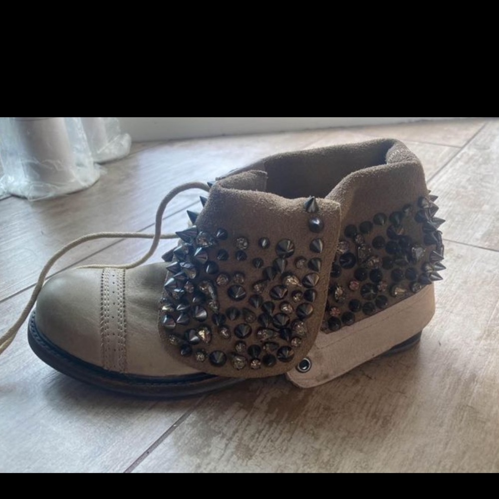 Stylish designers boots with metal studs , worn once
